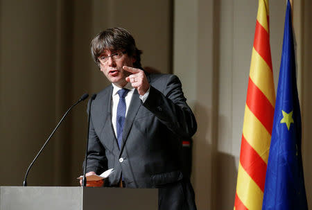 Former Catalan leader Carles Puigdemont gestures while delivering a speech to Catalan mayors in Brussels, Belgium, November 7, 2017. REUTERS/Pascal Rossignol