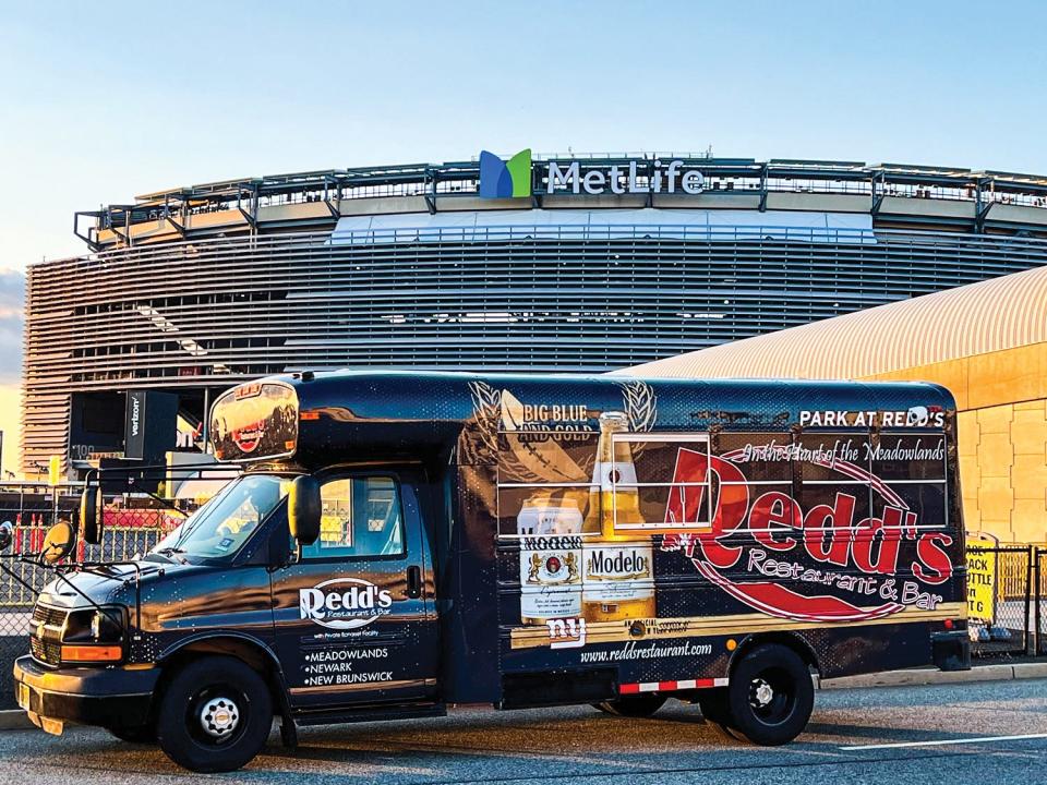 In addition to serving food like the popular “Half Way” sandwich and a wide selection of local and imported beers, Redd’s Restaurant & Bar also offers shuttle service to and from MetLife Stadium.