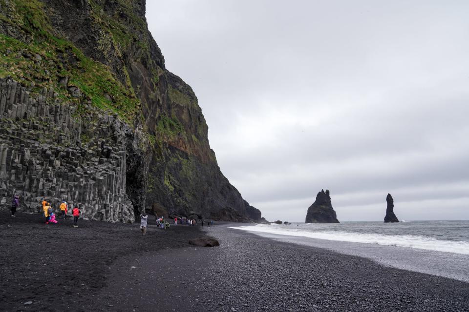 View of rock formations just off the coast of black-sand beaches in Iceland