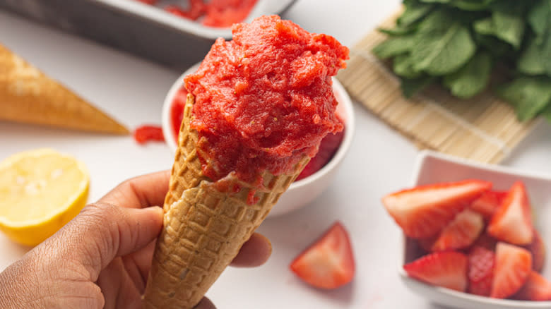strawberry sorbet in waffle cone