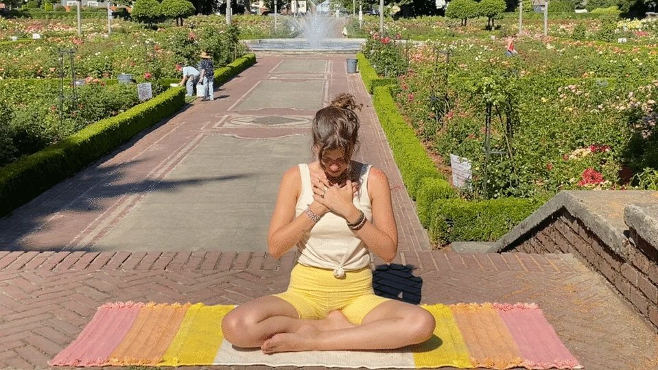 Woman seated on a yoga mat in quiet meditation