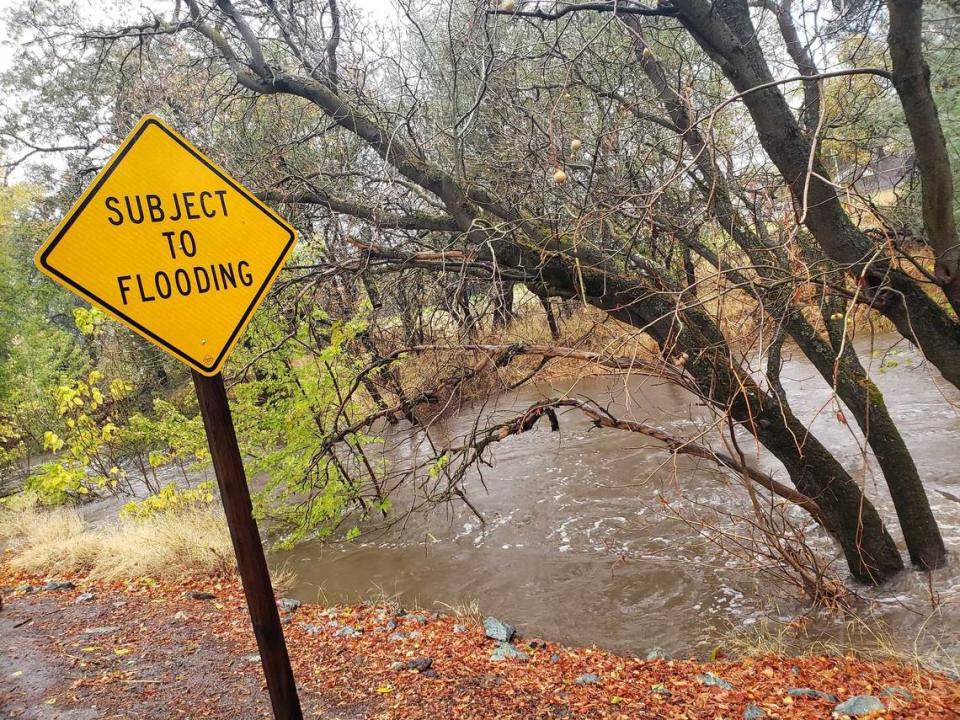 Water is seen filling up Arcade Creek along Winding Way near American River College in the Carmichael section of Sacramento County on Sunday, Oct. 24, 2021. A severe storm is bringing heavy rain and winds to the region.