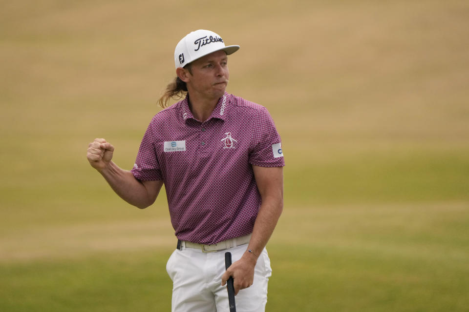 Cameron Smith, of Australia, celebrates after putting on the 18th green during the final round of the British Open golf championship on the Old Course at St. Andrews, Scotland, Sunday July 17, 2022. (AP Photo/Gerald Herbert)