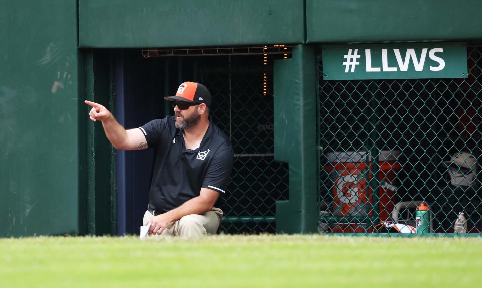 Smithfield manager Eric Gibree watches during the game against Southeast Region champion Nolensville, Tenn.,on Friday.