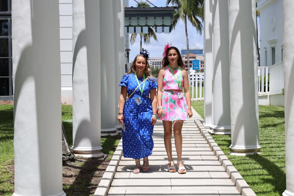 Vaia Galimanas, left, and her daughter Ariadne Kalogritsas, both of Ontario, walk along a path at the Henry Morrison Flagler Museum during The Pink Retreat.