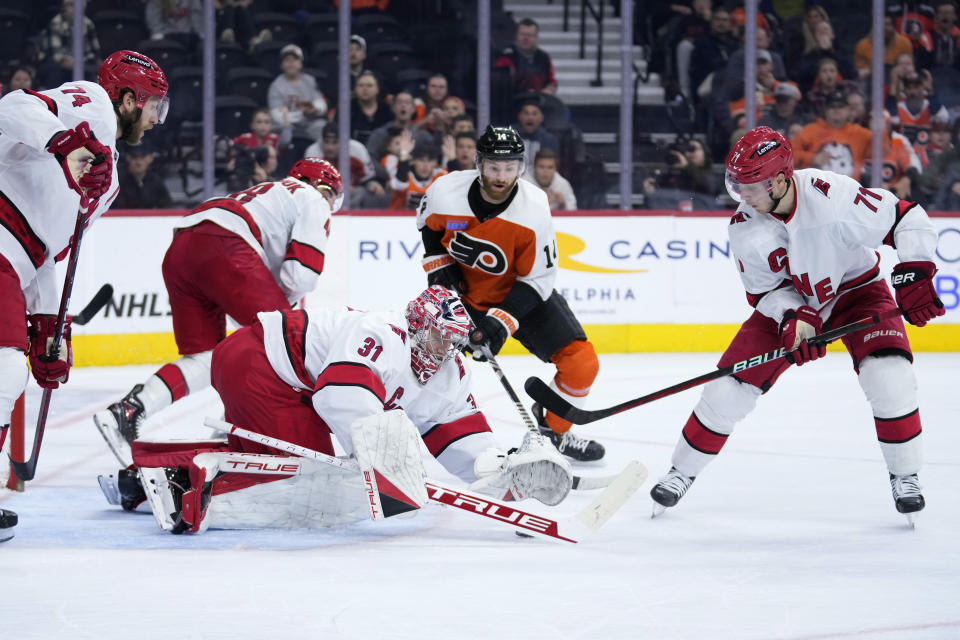 Carolina Hurricanes' Frederik Andersen covers up the puck during the second period of an NHL hockey game against the Philadelphia Flyers, Monday, Oct. 30, 2023, in Philadelphia. (AP Photo/Matt Slocum)