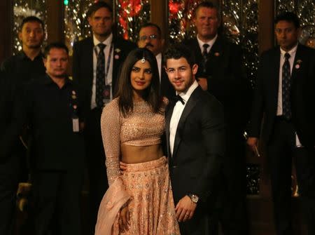 Actress Priyanka Chopra and her husband Nick Jonas arrive to attend the wedding ceremony of Isha Ambani, the daughter of the Chairman of Reliance Industries Mukesh Ambani, in Mumbai, India, December 12, 2018. REUTERS/Francis Mascarenhas