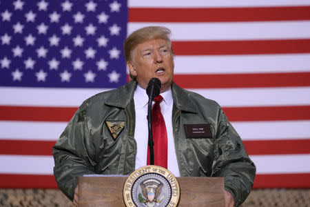 U.S. President Donald Trump delivers remarks to U.S. troops in an unannounced visit to Al Asad Air Base, Iraq December 26, 2018. REUTERS/Jonathan Ernst