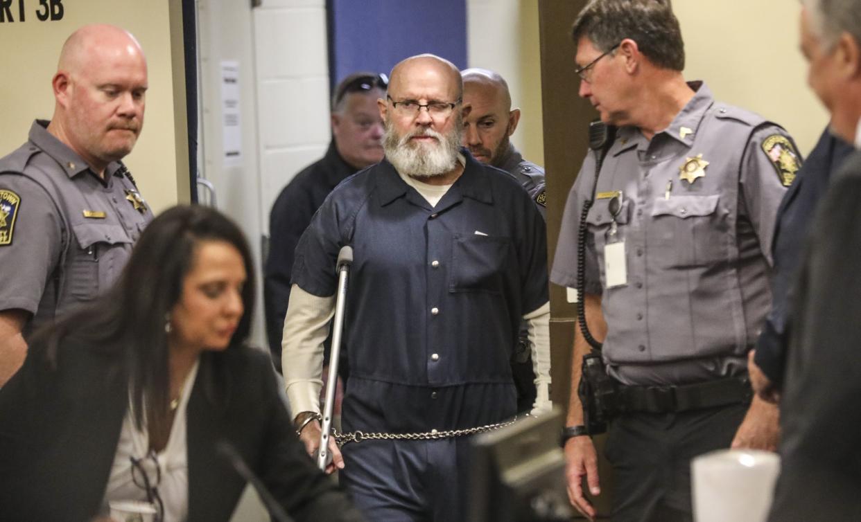 Raymond Moody is escorted into the courtroom Wednesday.