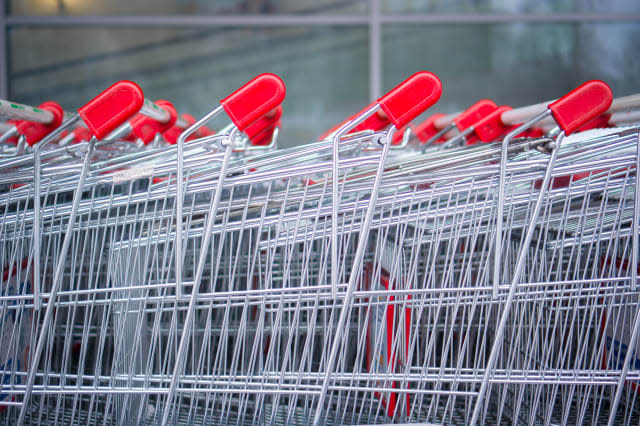 rows of shopping carts on car...