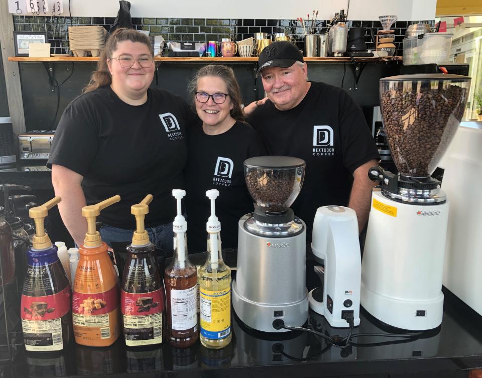 Emily Macomber and her parents, Heidi and Joe, serve up coffee and other drinks at the new, Next Door Coffee in Canandaigua.
