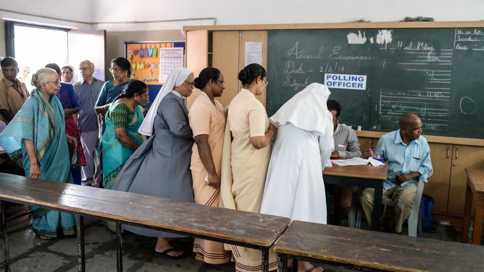 Voters register at a polling station in Hyderabad on April 11, 2019. - Noah Seelam/AFP/Getty Images