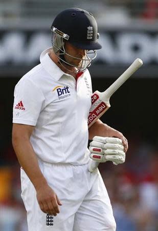 England's Jonathan Trott walks off the field after his dismissal by Australia's Mitchell Johnson during the third day's play of the first Ashes cricket test match in Brisbane November 23, 2013. REUTERS/David Gray