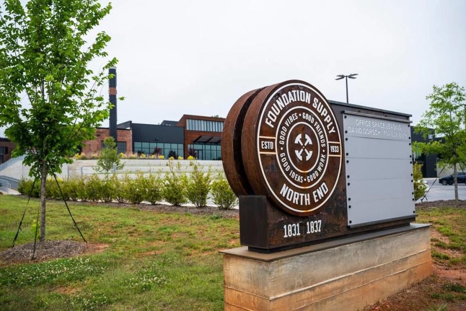 A sign for Foundation Supply, on North Tryon Street, displays office space available for lease Friday, May 27, 2022 in Charlotte, NC. The building has over 100,000 square feet of space available for business and retail in what was once an industrial warehouse and is a centerpiece property in what is now being called North End.