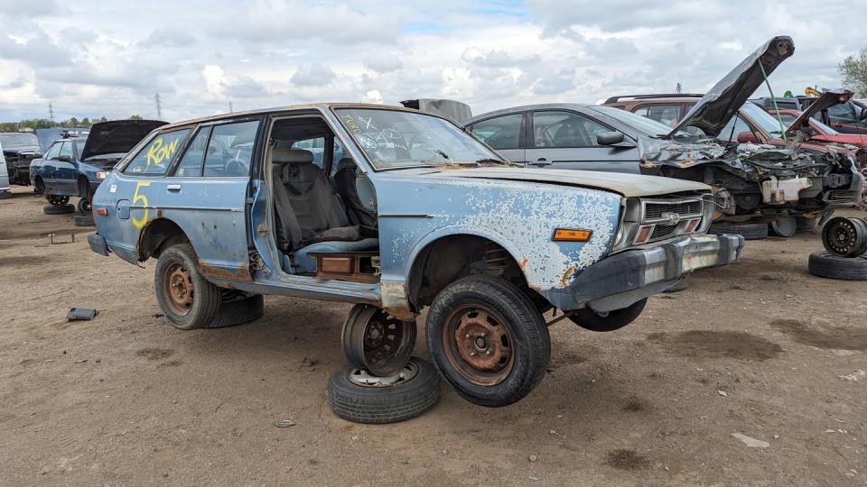 1980 datsun 210 wagon with 400k miles in colorado junkyard