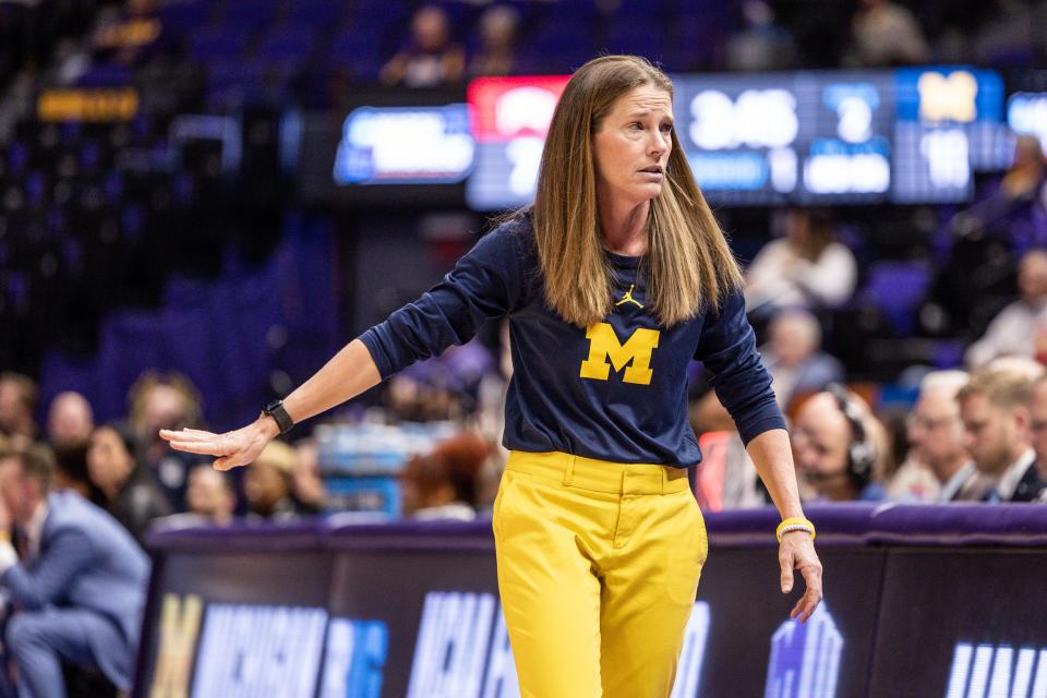 Michigan Wolverines head coach Kim Barnes Arico gives direction against the UNLV Rebels during the first half at Pete Maravich Assembly Center in Baton Rouge, Louisiana, on Friday, March 17, 2023.