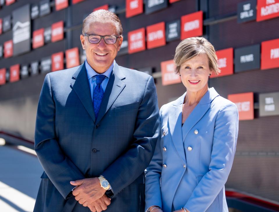 Don Smiley, Chief Executive Officer of Milwaukee World Festival Inc., and Sarah Pancheri, President of Milwaukee World Festival Inc., pose for a photo in front of the Wall of Fame outside of the The American Family Insurance Amphitheater on Friday, June 3, 2022 at the Henry Maier Festival Park in Milwaukee, Wis.