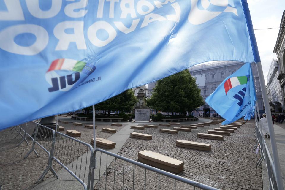 La Scala theatre square is filled with 172 coffins, as many as the number of deaths at work that Lombardy recorded in 2023, during a flash mob organised by UIL trade union organization, in Milan, Italy, Friday, May 10, 2024. (AP Photo/Luca Bruno)