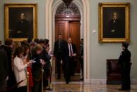 Reporters wait outside the US Senate chamber hearing only the third-ever impeachment trial of a US president