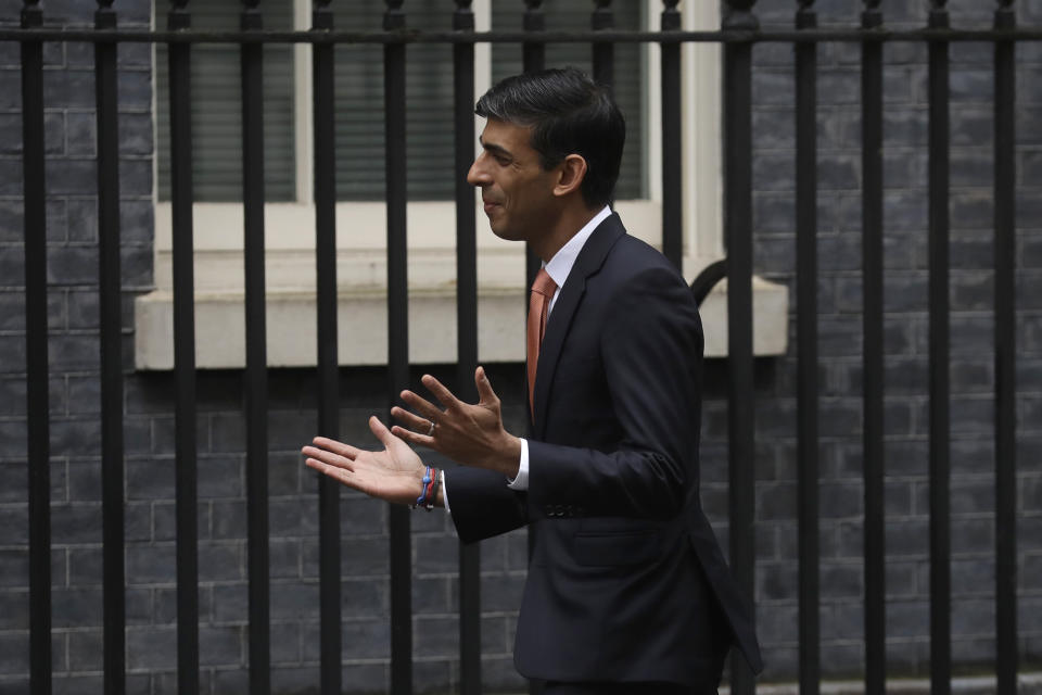 British lawmaker Rishi Sunak, Chief Secretary to the Treasury, Chief Secretary to the Treasury arrives at 10 Downing Street in London, Thursday, Feb. 13, 2020. British Prime Minister Boris Johnson shook up his government on Thursday, firing and appointing ministers to key Cabinet posts. Johnson was aiming to tighten his grip on government after winning a big parliamentary majority in December's election. That victory allowed Johnson to take Britain out of the European Union in January. (AP Photo/Matt Dunham)