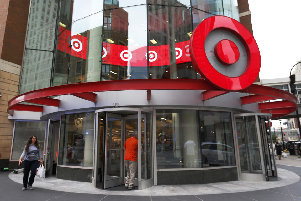 FILE - In this July 10, 2019, file photo shoppers visit the downtown Target Store in Minneapolis.  (AP Photo/Jim Mone, File)