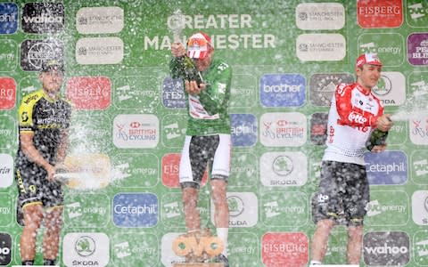 Van Der Poel, Trentin, and De Buyst shower each other with champagne - Credit: PA