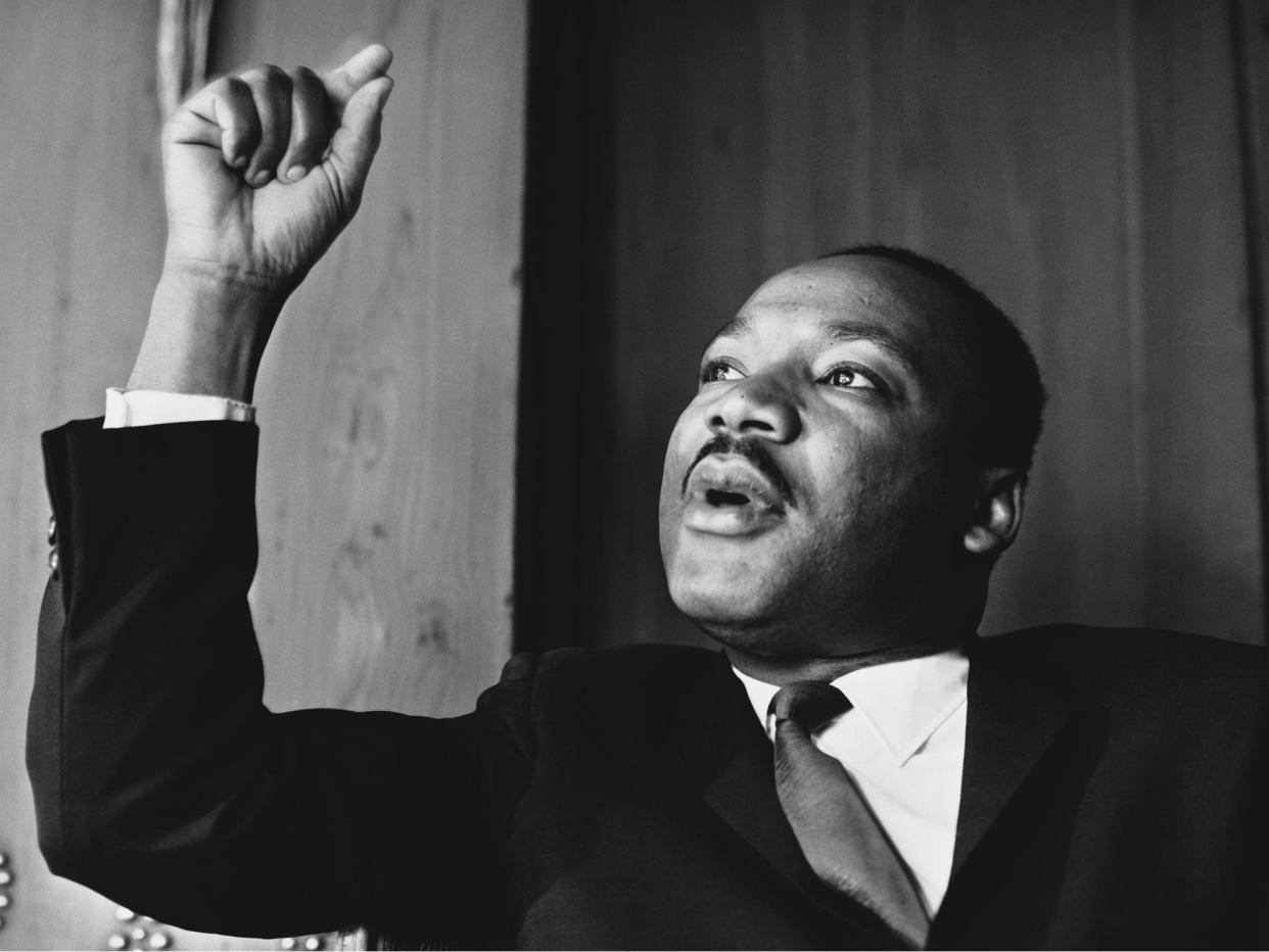 American civil rights leader Martin Luther King, Jr at a press conference in London, September 1964: Reg Lancaster/Daily Express/Hulton Archive/Getty Images