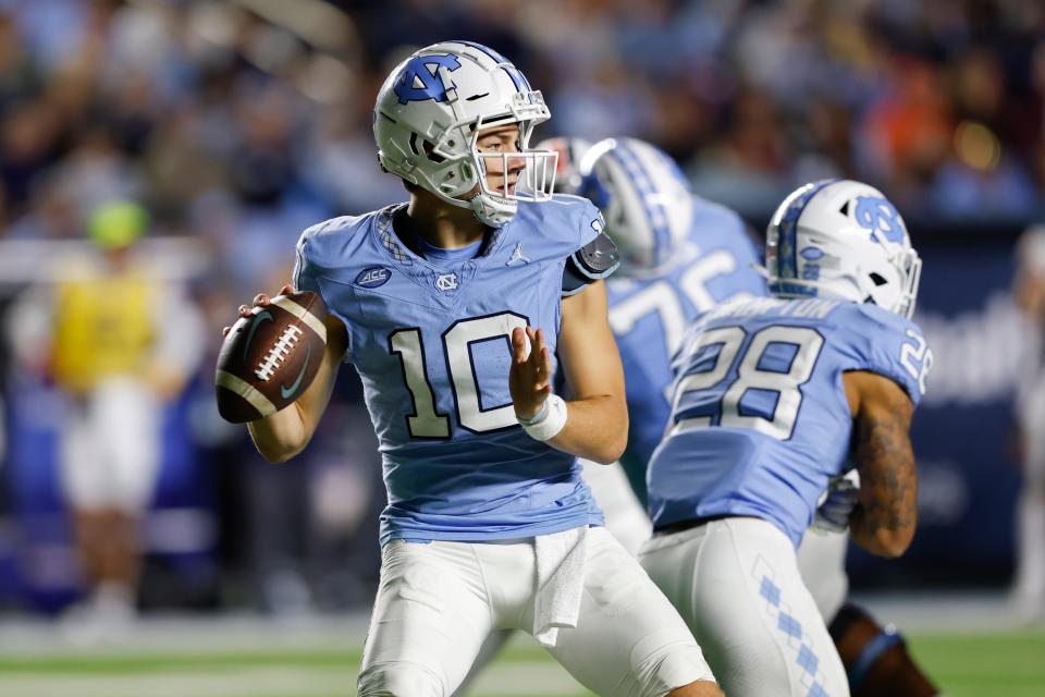 Oct 21, 2023; Chapel Hill, North Carolina, USA; North Carolina Tar Heels quarterback Drake Maye (10) looks to pass against the Virginia Cavaliers in the second half at Kenan Memorial Stadium. Mandatory Credit: Nell Redmond-USA TODAY Sports