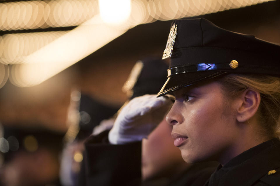 New NYPD graduate saluting