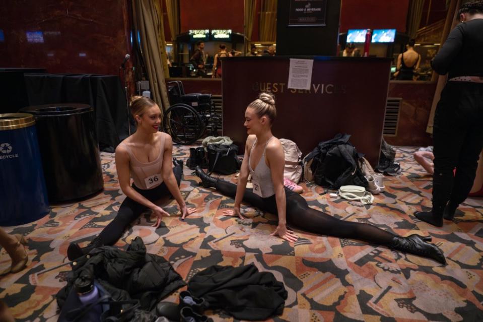 Dancers warm up and stretch in the lobby of the Radio City Music Hall during auditions. AP