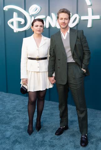 <p>Frank Micelotta/Disney via Getty</p> Ginnifer Goodwin and Josh Dallas pose on the red carpet at the official launch of Hulu on Disney+