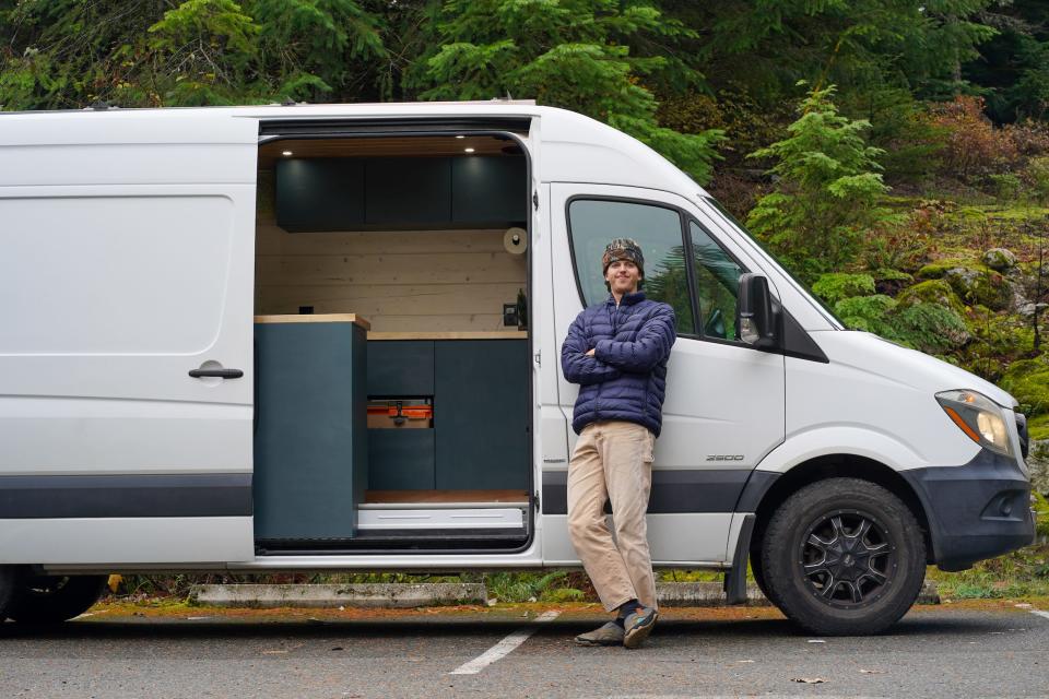 Zach Nelson stands in front of his converted sprinter van.
