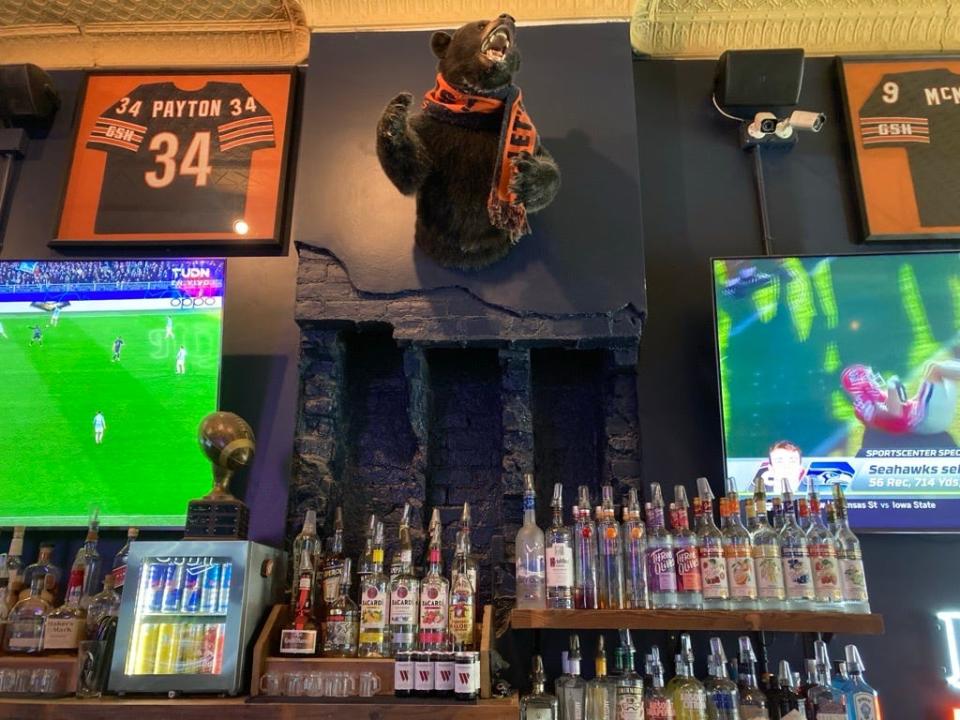 The bear above the bar greets customers at the Chicago Bears-themed 85 Bar in the East Village in Des Moines. The bar is adding a second location, 85 Bar West, in Waukee.