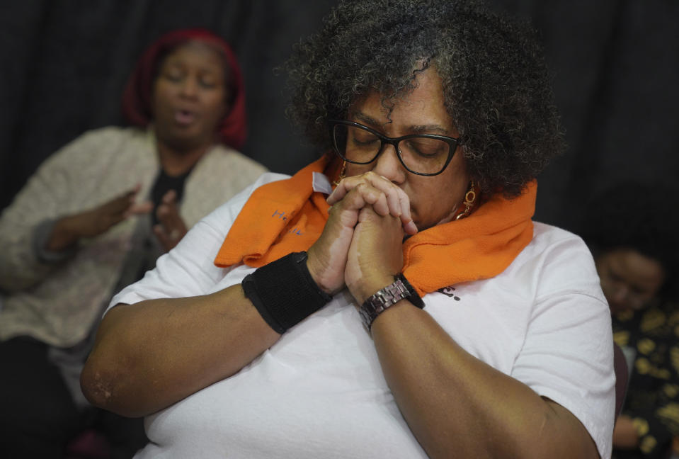 Michelle Middleton, a member of The Heritage Gospel Chorale of Pittsburgh, prays after rehearsal on Monday, March 6, 2023, at Bethany Baptist Church in Pittsburgh. The chorale ensemble will be one of two performers at an upcoming concert honoring the work of late gospel composer, musician and publisher, Charles Henry Pace. The free concert will be held at Ebenezer Baptist Church in Pittsburgh on March 25, as part of an effort to recognize Pace as an early pioneer of gospel music and one of the early and only publishers of Black artists in the niche genre. (AP Photo/Jessie Wardarski)