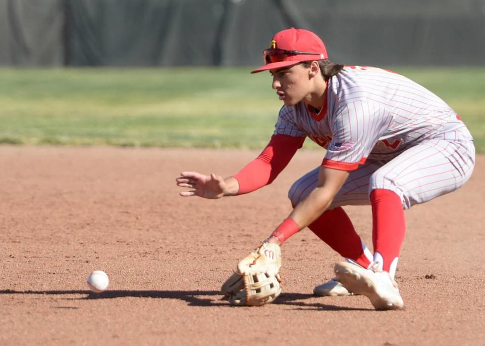 Oakdale second baseman Carlo Antinetti fields a ground ball during the CIF Sac-Joaquin Section Quarterfinals against Vista del Lago at Oakdale High School on May 9, 2024. Oakdale won 10-5.