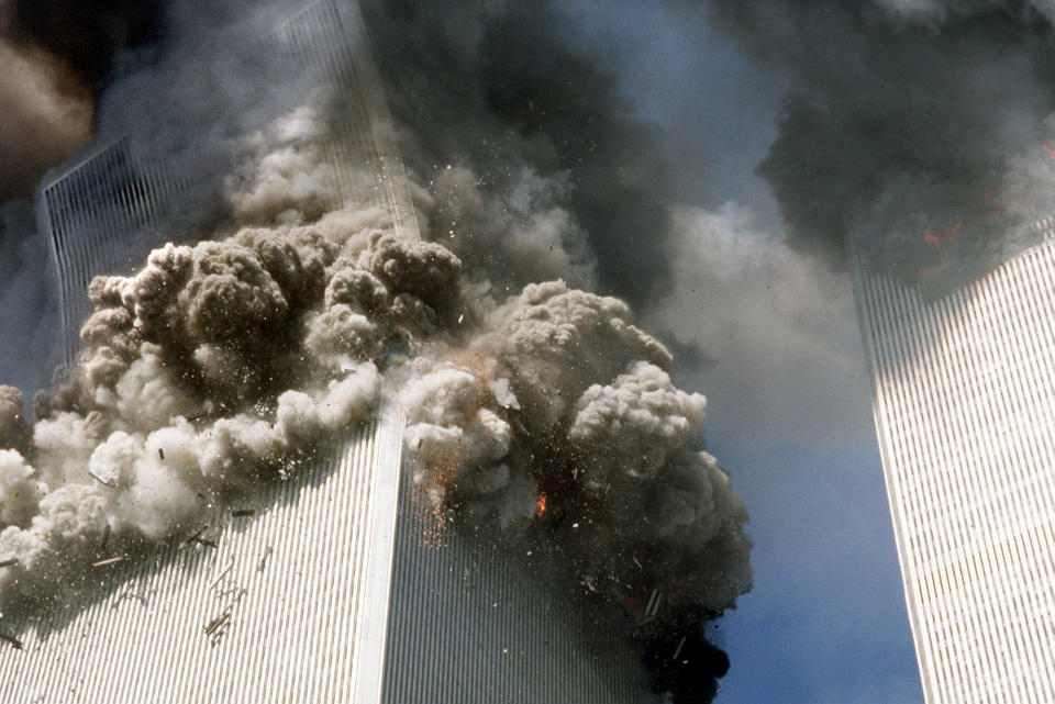 FILE - In this Sept. 11, 2001, file photo, the south tower of the World Trade Center, left, begins to collapse after a terrorist attack on the landmark buildings in New York. (AP Photo/Gulnara Samoilova, File)