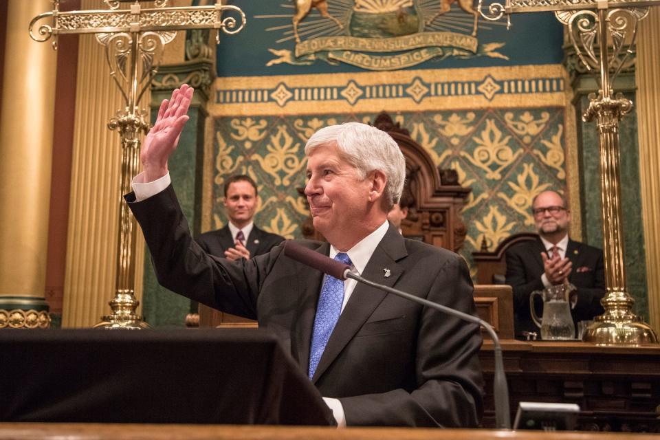 Governor Rick Snyder waves at the crowd before his State of the State address in the House of Representatives Chamber at the State Capitol in Lansing on Tuesday, January 23, 2018.