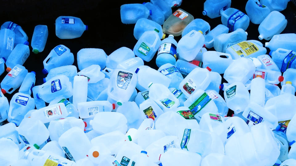 A ton of plastic bottles falling like rain into a big pile.