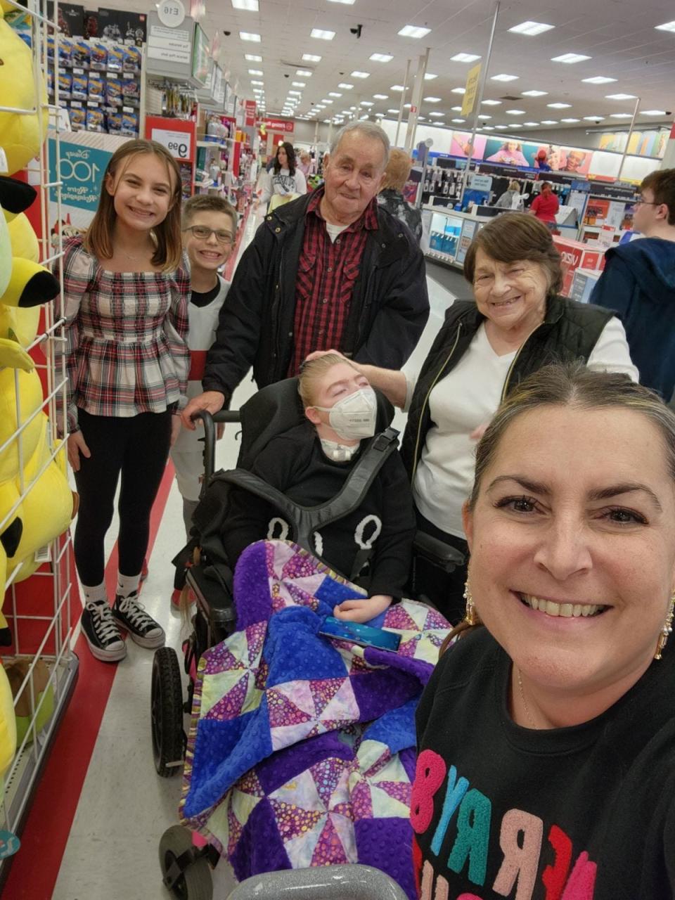 Stephanie Snee, right, and her children accompanied Marvin and Lori Penrod and Marissa Anderegg on a shopping trip to Target after the family acquired a wheelchair-accessible van for Marissa with funds Snee helped to raise through the Foundation for Community Betterment.
