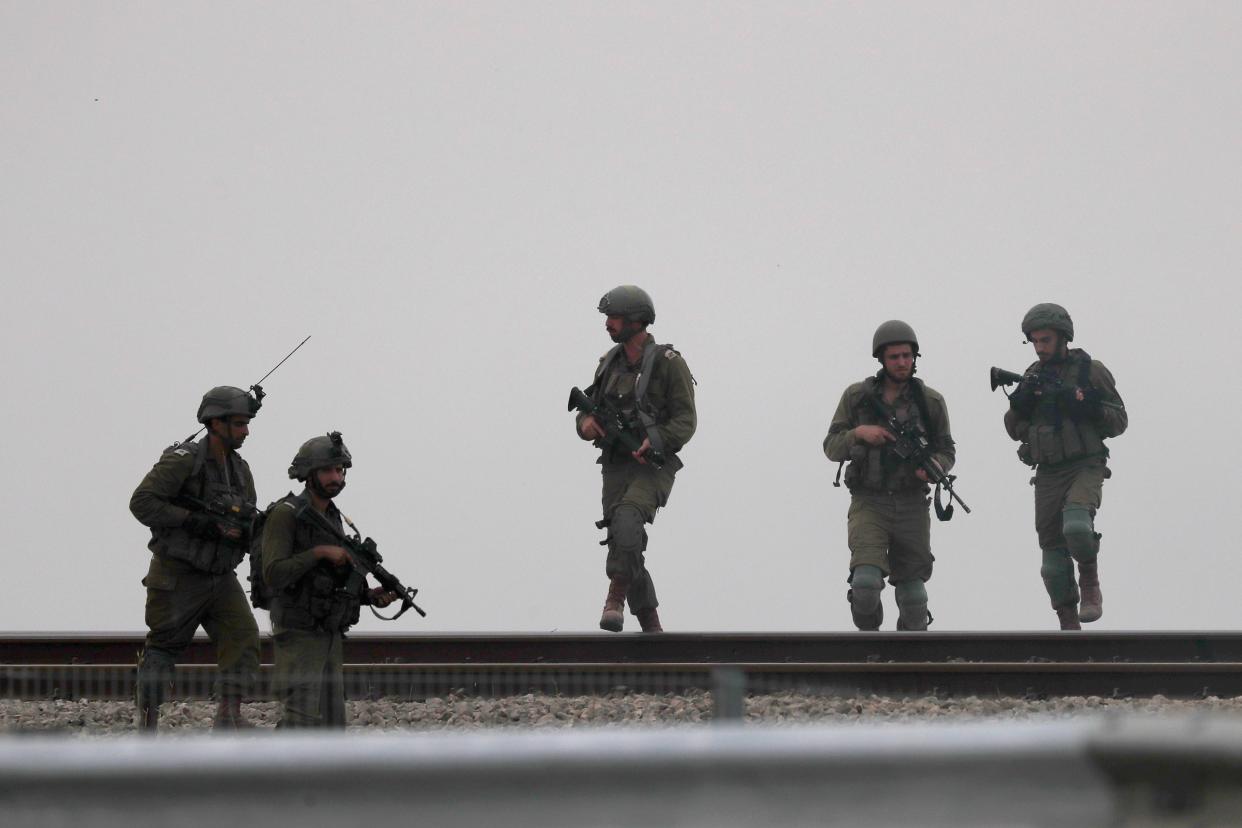 Israeli soldiers patrol the area next to the  border with Gaza, near Sderot, southern Israel on Monday (EPA)