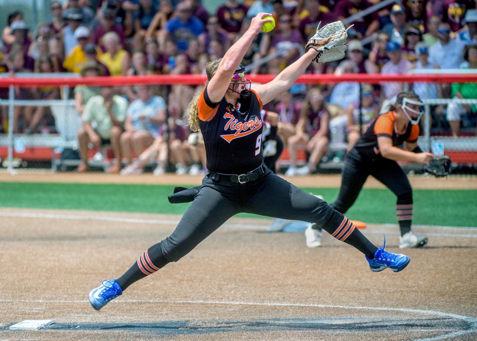 Illini Bluffs's Cora Ellison floats off the pitcher's circle as she throws against LeRoy in the Class 1A softball state semifinals Friday, June 2, 2023 at the Louisville Slugger Sports Complex in Peoria. The Tigers advanced to the state title game with a 10-0 win in five innings.
