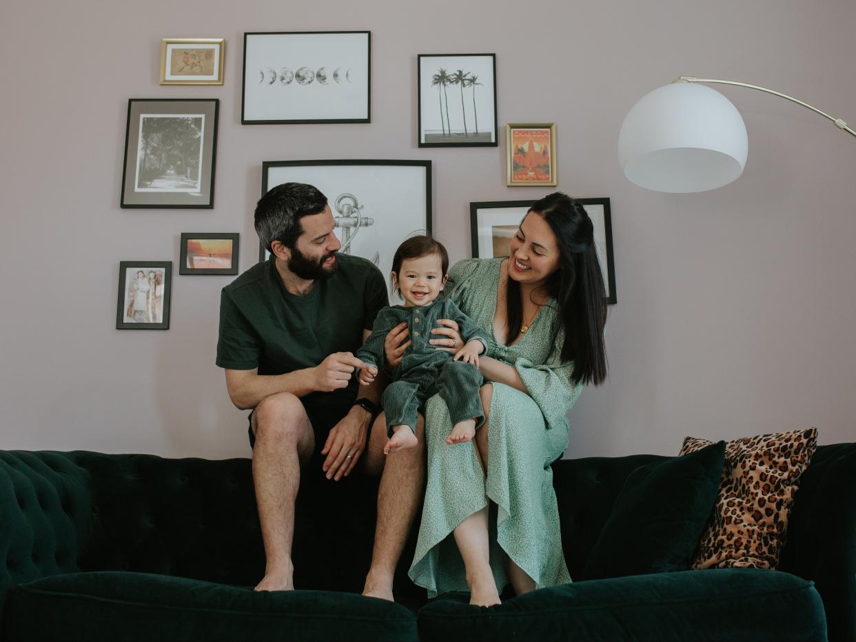 <p>Yumi Palmer (R), with her family, in the townhouse they are raffling off for £3</p> (Ania Hrycyna)