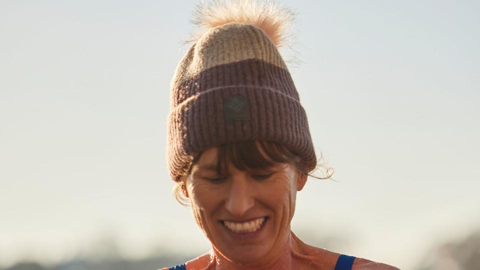 woman in a bobble hat and swimming costume 