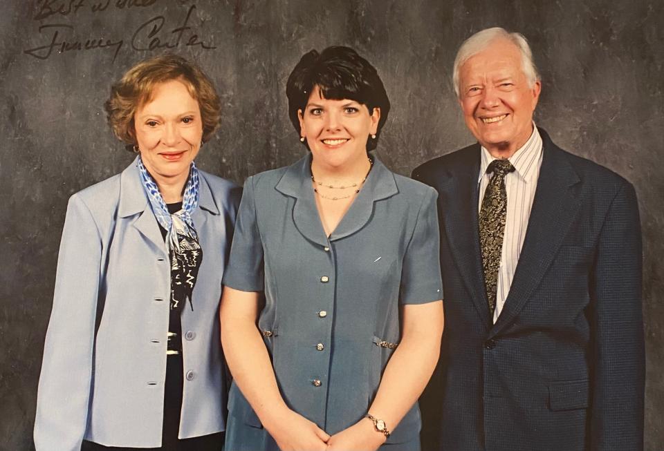 Kelly Gagan with Rosalynn and Jimmy Carter in 1998.