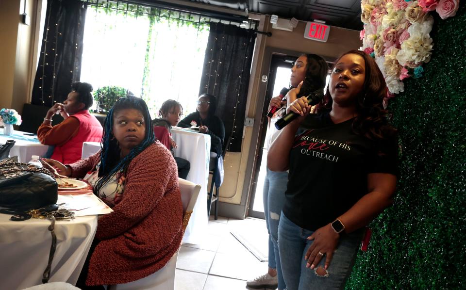 Lesley Gant of Because of His Love Outreach talks to a room full of expectant and recent parents during a baby shower she and her husband, Robert Gant, hosted at Harmony Café in Detroit on May 20, 2023. The Gants hosted the shower for expectant parents and moms who had recently given birth. They offered classes, had a raffle of baby items and gift bags full of diapers and other baby supplies.