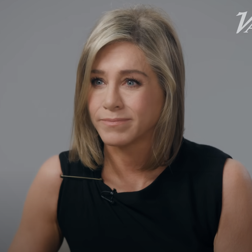 Jennifer Aniston in a sleeveless black top, sitting and facing forward during an interview with Variety's logo in the top right corner