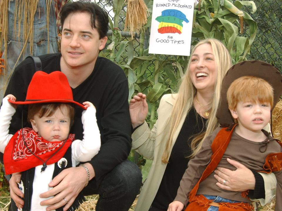 Brendan Fraser and Afton Smith pose with sons Holden and Griffin in 2005.