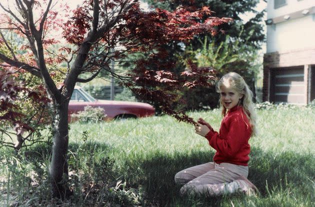 The author, age 9, in the family's front yard, in a photo taken by her father. (Photo: Courtesy of Tracy Strauss)