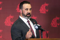 FILE - In this Thursday, Jan. 16, 2020, file photo, new Washington State head football coach Nick Rolovich speaks during an NCAA college football news conference after being officially introduced in Pullman, Wash. Normally, in March, college football teams would be preparing for the upcoming season. Because of the new coronavirus pandemic, coaches are trying to figure out how to recreate some of what has been lost. Rolovich said the Cougars will continue to learn their new offensive and defensive systems...online. (Pete Caster/Lewiston Tribune via AP, File)/