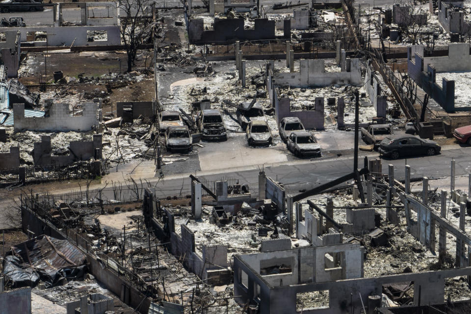 FILE - A general view shows the aftermath of a devastating wildfire in Lahaina, Hawaii, Aug. 22, 2023. Hawaii Gov. Josh Green is announcing the creation of a $150 million fund to help those who lost family members or who were injured in Maui’s wildfires. The governor's office says beneficiaries will receive payments of more than $1 million as early as the April-June quarter of next year. (AP Photo/Jae C. Hong, File)